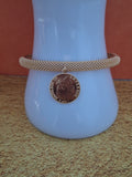 Bracelet avec pièce doré